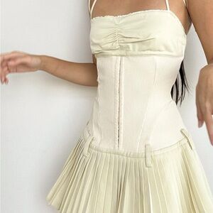 Chic Cream Mini Dress with Pleated Skirt